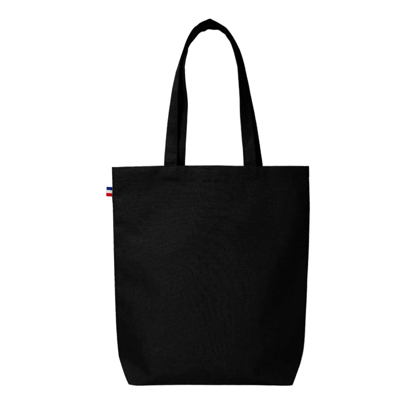 Sac cabas en coton beige avec soufflet de fond, fabriqué en France, posé sur une table en bois avec accessoires de mode

