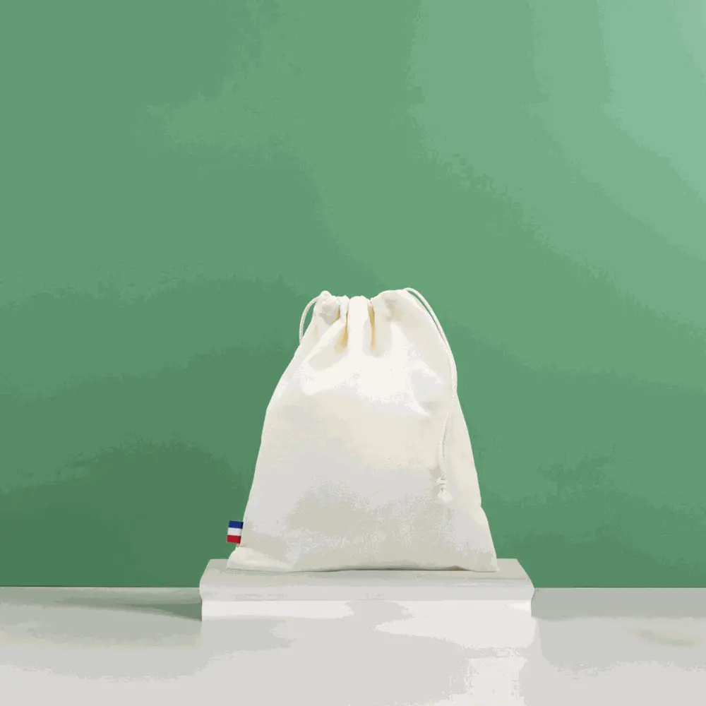 Pochon écoresponsable en coton bio GOTS blanc, grand sac durable et fabriqué en France, idéal pour la plage et le quotidien.