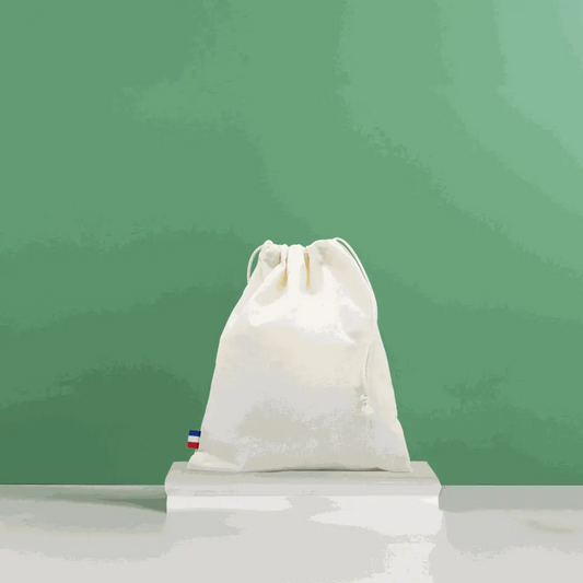Pochon écoresponsable en coton bio GOTS blanc, grand sac durable et fabriqué en France, idéal pour la plage et le quotidien.
